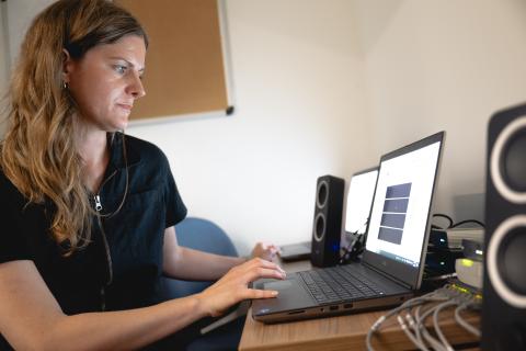 Sarah Borowski looking at data on her laptop.